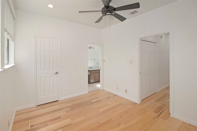 Spacious secondary bedroom with its own en suite bath and walk-in closet. | Image 30