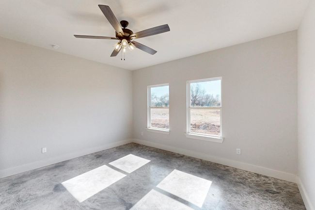 Spare room featuring baseboards and a ceiling fan | Image 20