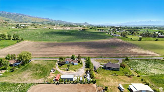 Aerial overview of property's location with a mountain backdrop and rural landscape | Image 30