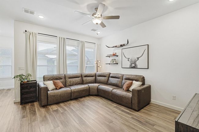 Luxury vinyl plank flooring throughout the main floor | Image 11