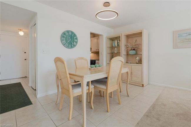 Dining area with light tile floors | Image 12