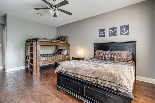 Bedroom with ceiling fan and dark hardwood / wood-style flooring | Image 22