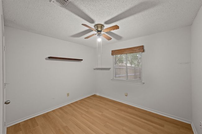 Spare room featuring ceiling fan, light wood-style flooring | Image 29