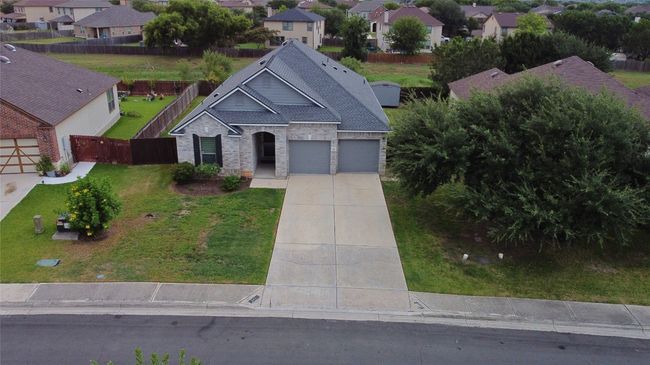 View of front of property with a residential view, concrete driveway, and brick siding | Image 38