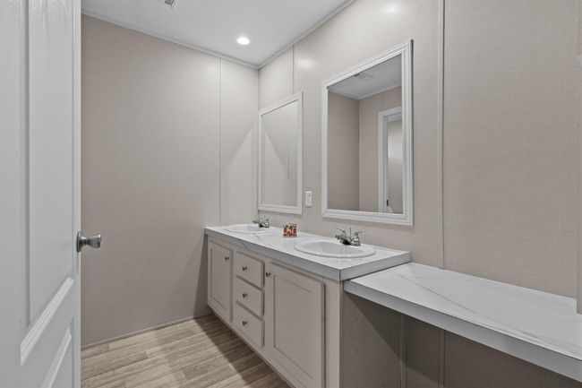 The centerpiece is a spacious 2, 061 sq ft manufactured home, just 1.5 years old, with 4 bedrooms, 2 bathrooms, and a beautifully crafted 40' x 20' stone outdoor kitchen under a covered roof with lighting—ideal for hosting under the stars. | Image 14