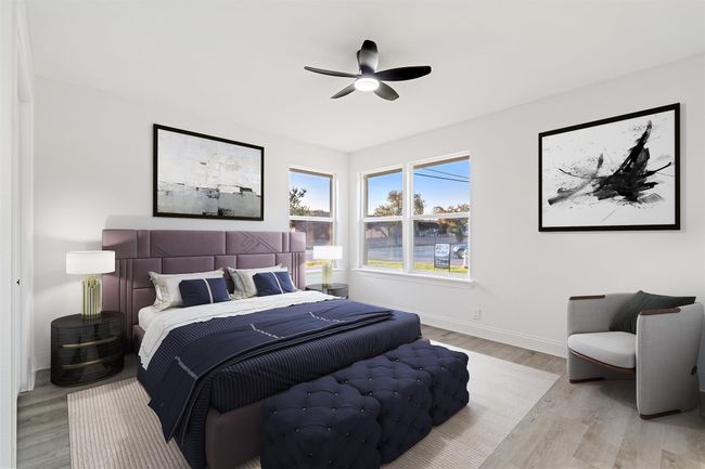 Bedroom with ceiling fan and light wood-type flooring | Image 23