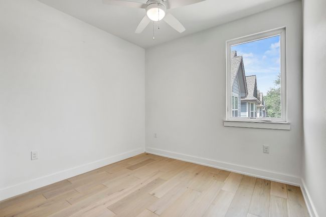 Empty room featuring light wood finished floors and baseboards | Image 6