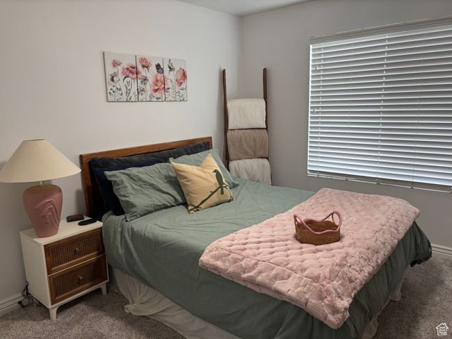 Bedroom featuring carpet flooring and baseboards | Image 8