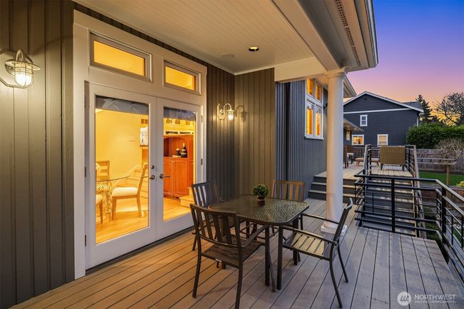 Another dining or seating area off of the French doors to the main house. Note the meticulous paint job on the exterior. Everything has been maintained to perfection. | Image 33