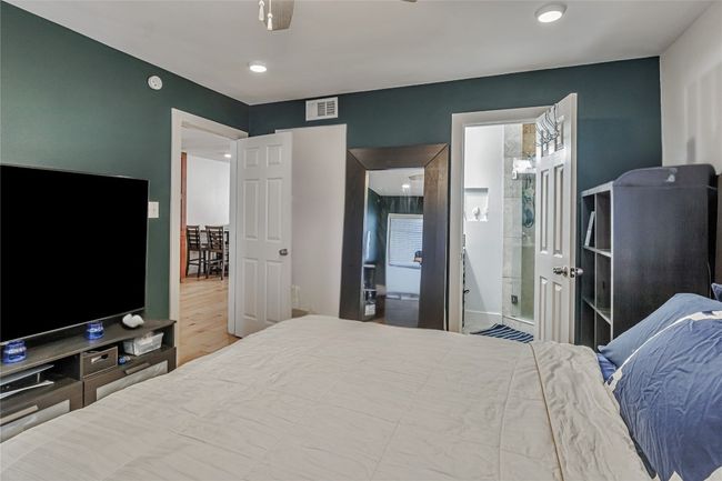 Bedroom with wood finished floors and recessed lighting | Image 8