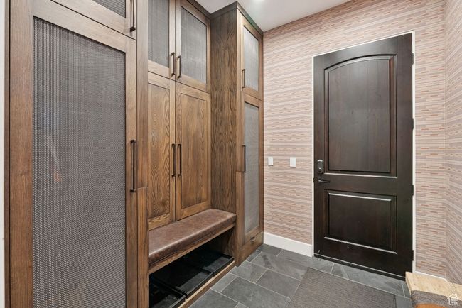 Mudroom with baseboards and wallpapered walls | Image 77