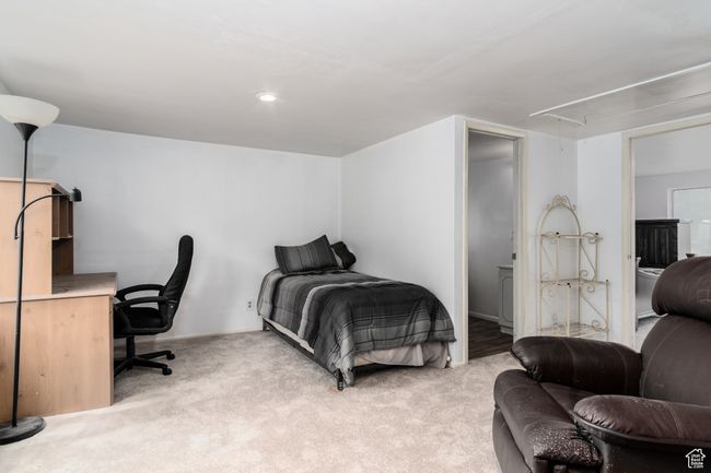 Bedroom featuring attic access and light carpet | Image 23