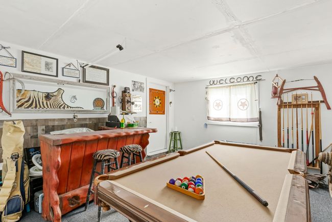 Playroom with carpet floors and a dry bar | Image 59