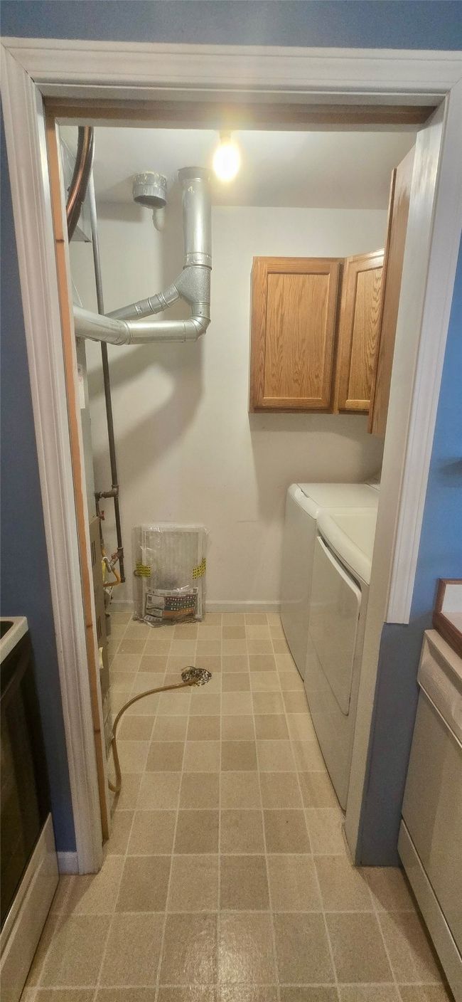 Bathroom with shower / tub combo with curtain, vanity, and toilet | Image 29