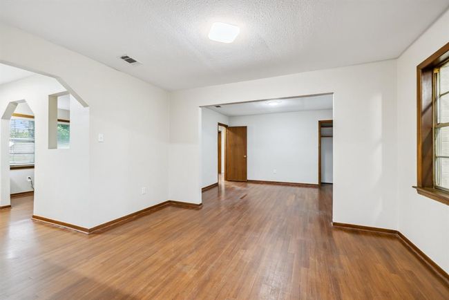 Breakfast area off foyer and Bedroom #3. Spacious and open to the kitchen. Great area for a break room too. Window on right looks into sunroom. | Image 10