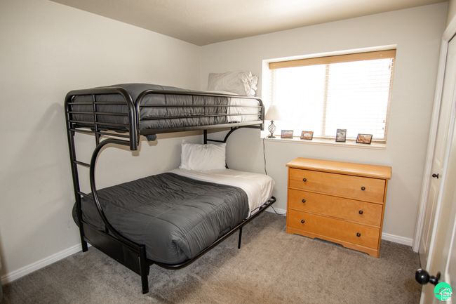 Carpeted bedroom with baseboards | Image 16