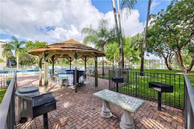 Poolside Tiki Hut with Grill and Tables and Chairs for your use | Image 52