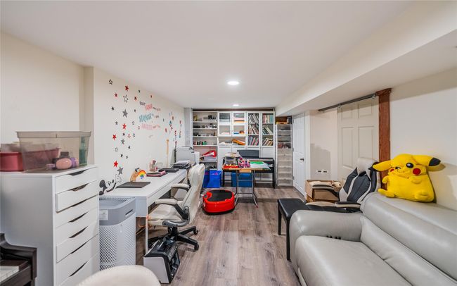 Office space featuring wood finished floors and recessed lighting | Image 34