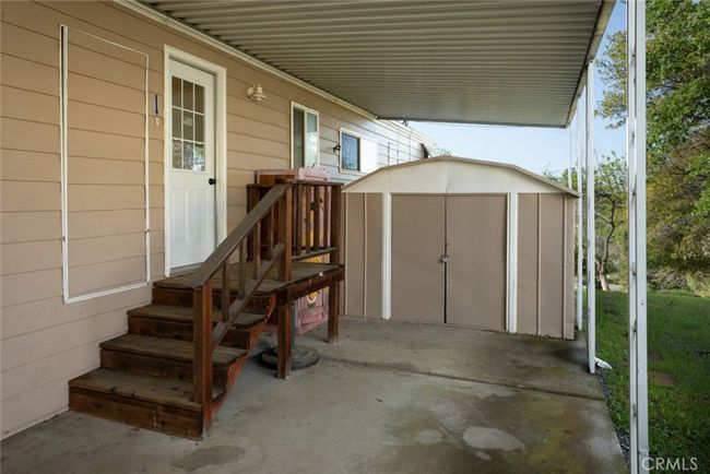 Entrance from carport to laundry room. | Image 38