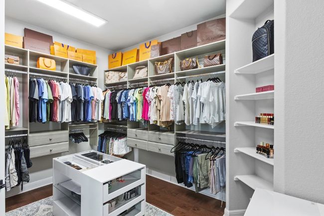 Walk in closet with wood flooring | Image 25
