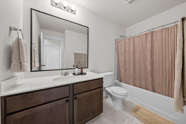 Full bath with vanity & shower / tub combo. | Image 17