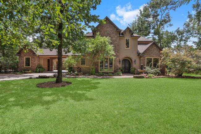 The front yard is fully gated with your own private automatic driveway gate.. | Image 8