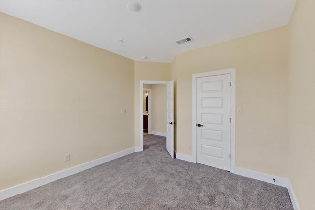 Unfurnished bedroom with carpet and baseboards | Image 25