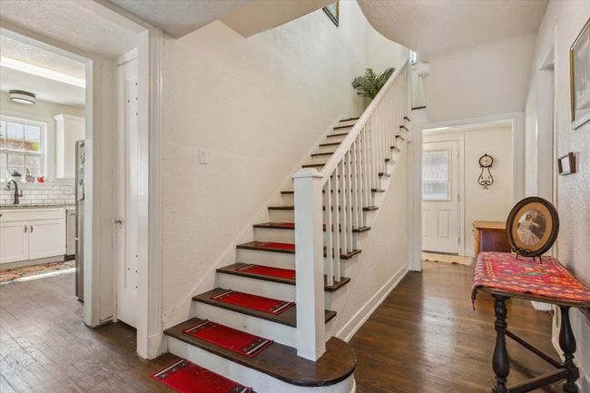 Stairs featuring hardwood / wood-style floors | Image 16