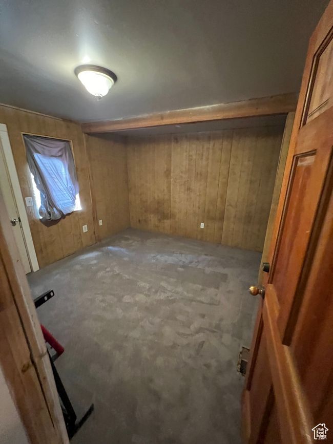 Interior space featuring wood walls and carpet | Image 4