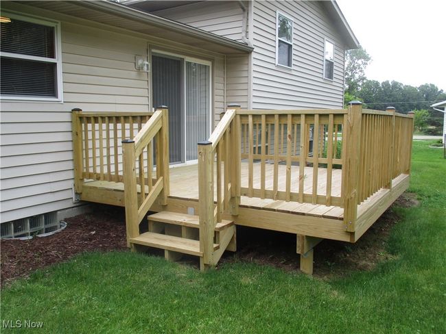 Wooden deck another view featuring the yard | Image 23