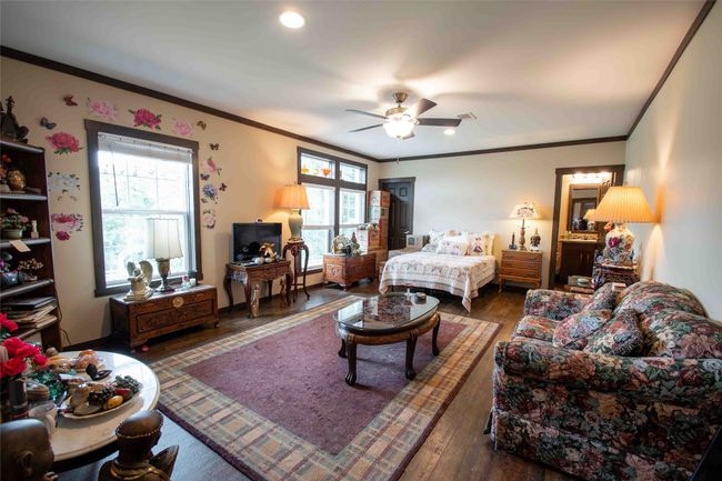 second Master Bedroom featuring hardwood / wood-style floors, multiple windows, crown molding, recessed lighting, and ceiling fan | Image 20