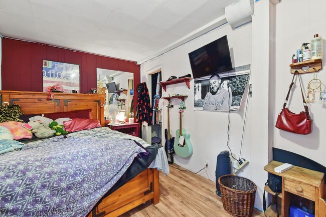 Bedroom featuring wood finished floors | Image 24