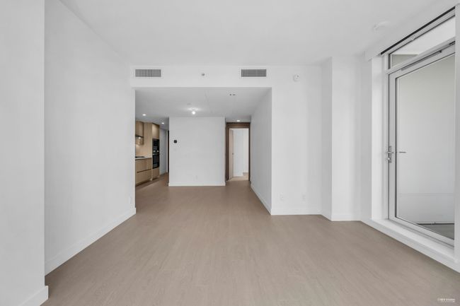 Unfurnished living room with light wood-type flooring and baseboards | Image 12