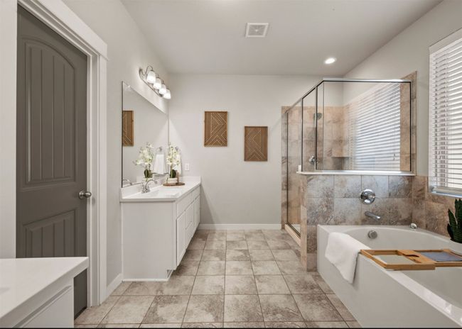 Dual vanities with a custom closet | Image 21