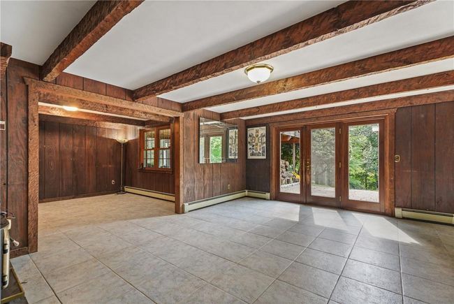 Lower lvl fm rm w light beamed ceiling slider backyard | Image 24