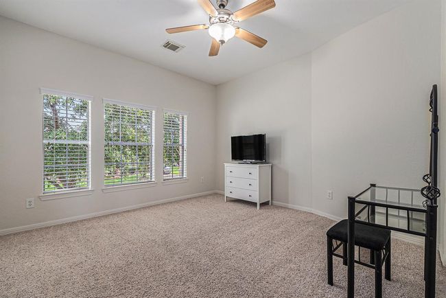 The last of the secondary bedrooms is tucked away from the rest making it a great private space, or maybe a second home office, with views of the trees! | Image 33