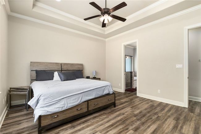 There’s ample space for your kingsized bedroom furniture, with double doors leading to the ensuite bathroom for added convenience and a seamless flow. | Image 18