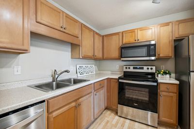 Newer SS appliances and plenty of storage. | Image 2