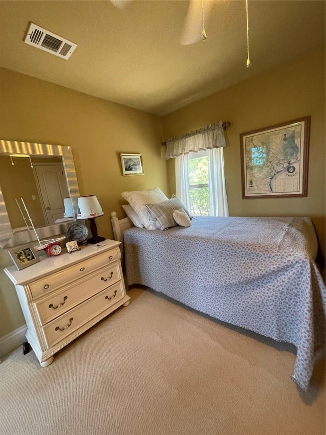 All bedrooms enjoy views of the wooded lot. | Image 9