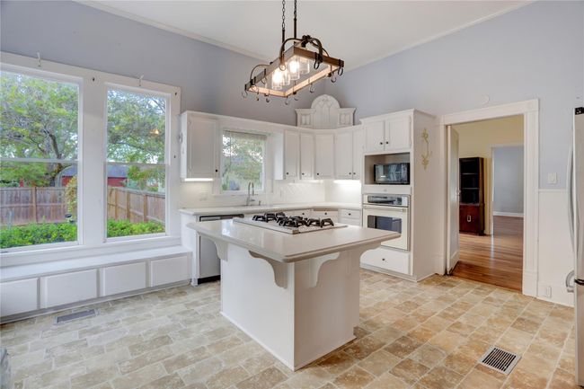 THE GOURMET KITCHEN! SILESTONE COUNTERS, TILE BACKSPLASH, ISLAND W/VIKING GAS STOVETOP, BUILT-IN PROFESSIONAL OVEN, FARM SINK, WIDE PICTURE WINDOWS & MORE. | Image 8