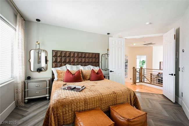 Bedroom featuring baseboards, designer styled flooring and ceiling fan | Image 51