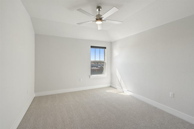 Empty room featuring ceiling fan and light carpet | Image 31