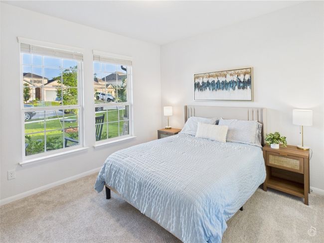 Carpeted bedroom with baseboards | Image 26