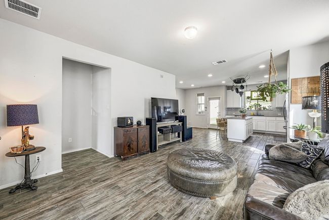 Spacious living area with 10ft ceilings. | Image 4