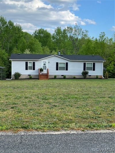 Manufactured / mobile home with a front yard | Image 1