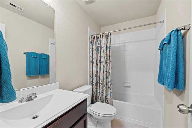 Your secondary bathroom with large vanity, offers convenience and comfort. | Image 18