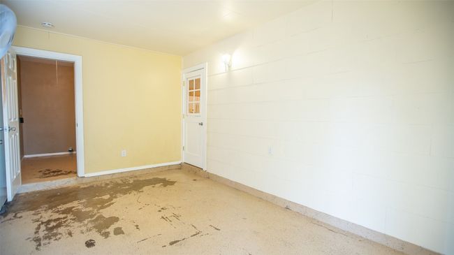 Converted garage enclosed area immediately off the kitchen. | Image 20