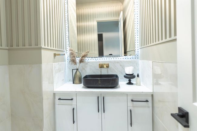 Bathroom featuring vanity and backsplash | Image 12