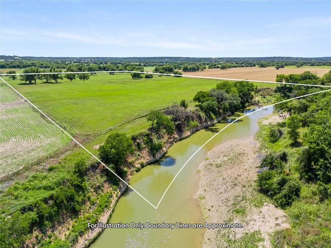Aerial view of sparsely populated area with a nearby body of water | Image 10