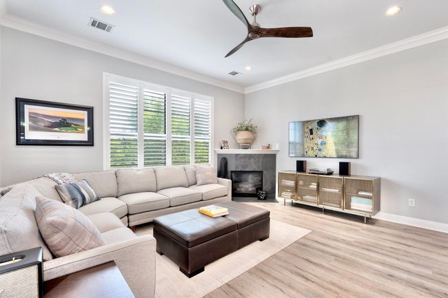 Relax in your living room with an inviting fireplace! | Image 10